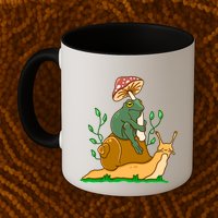 Cute Frog Riding A Snail A Whimsical Illustration Mug