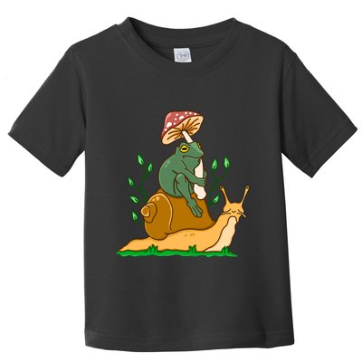 Cute Frog Riding A Snail A Whimsical Illustration Toddler T-Shirt