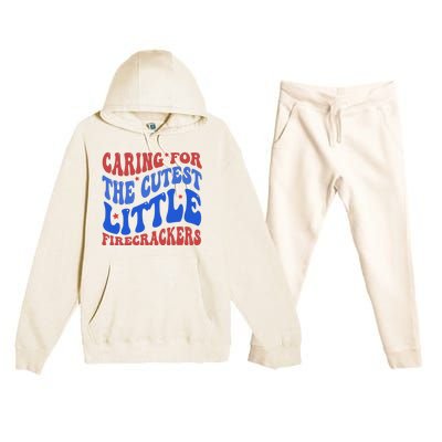 Caring For The Cutest Little Firecrackers 4th Of July Premium Hooded Sweatsuit Set