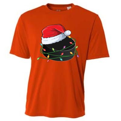 Christmas Hockey Puck In Santa Hat Wrapped In Holiday Lights Cool Gift Cooling Performance Crew T-Shirt