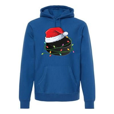 Christmas Hockey Puck In Santa Hat Wrapped In Holiday Lights Cool Gift Premium Hoodie