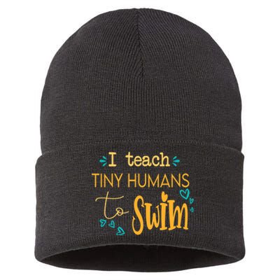 cool swim coach I teach tiny humans to swim swimming teacher Sustainable Knit Beanie