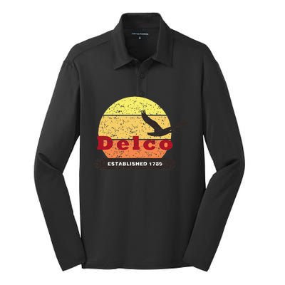 Delco Est. 1789 Goose Distressed Silk Touch Performance Long Sleeve Polo