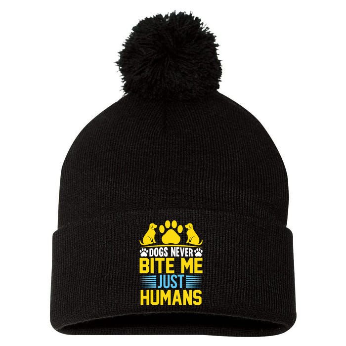 DOGS NEVER BITE ME JUST HUMANS Pom Pom 12in Knit Beanie