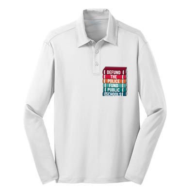 Defund The P.O.L.I.C.E Fund Public Schools Silk Touch Performance Long Sleeve Polo