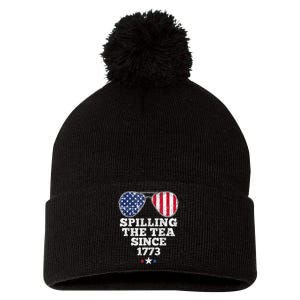 Funny 4th Of July Spilling The Tea Since 1773 American Flag Pom Pom 12in Knit Beanie