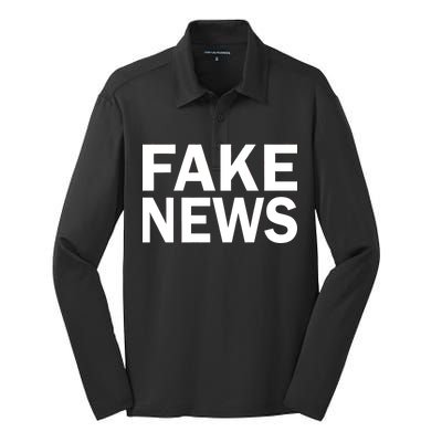 Fake News Bold Text Silk Touch Performance Long Sleeve Polo