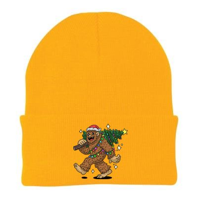 Funny Bigfoot Carrying Christmas Tree Holiday Sasquatch Knit Cap Winter Beanie