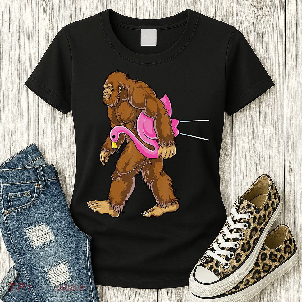 Funny Bigfoot Carry Flamingo Walking Sasquatch Believe Womens T-Shirt
