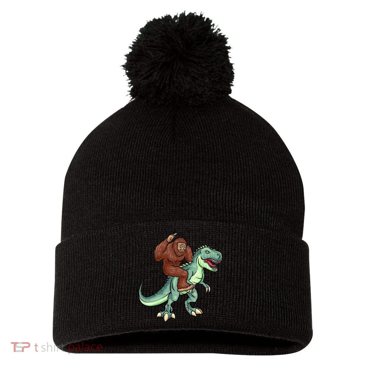 Funny Bigfoot Riding T Rex Funny Bigfoot Dinosaur Pom Pom 12in Knit Beanie