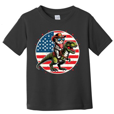 Funny Cowboy Cat Riding Dinosaur Usa Flag Trex 4th Of July Toddler T-Shirt