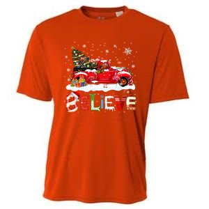 Flamingo Riding Red Truck Christmas Tree Believe Santa Gift Cooling Performance Crew T-Shirt