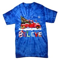 Flamingo Riding Red Truck Christmas Tree Believe Santa Gift Tie-Dye T-Shirt