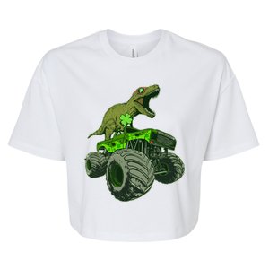 Funny St Patrick's Day Lucky Trex Dinosaur Riding Monster Truck Bella+Canvas Jersey Crop Tee