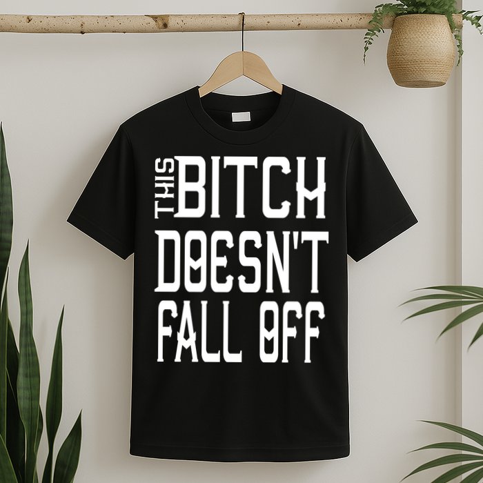 Funny THIS BITCH DOESN'T FALL OFF T-Shirt