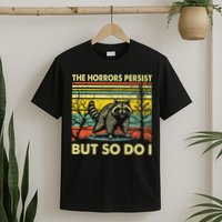 Funny The Horrors Persist But So Do Raccoon Meme Sarcastic T-Shirt
