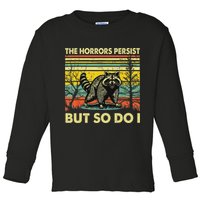 Funny The Horrors Persist But So Do Raccoon Meme Sarcastic Toddler Long Sleeve Shirt