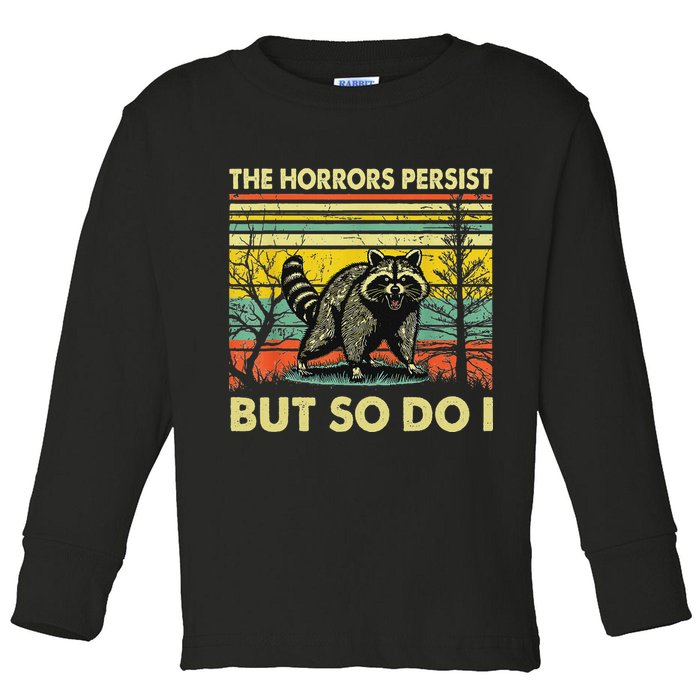 Funny The Horrors Persist But So Do Raccoon Meme Sarcastic Toddler Long Sleeve Shirt