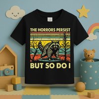 Funny The Horrors Persist But So Do Raccoon Meme Sarcastic Toddler T-Shirt