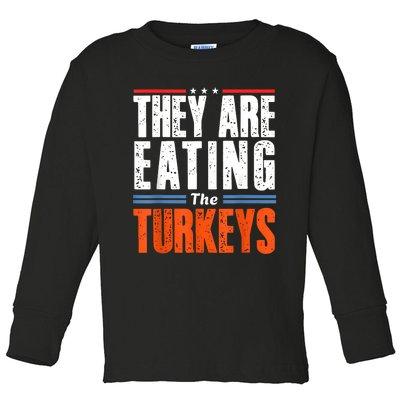 Funny Trump Saying They Are Eating The Turkeys Toddler Long Sleeve Shirt