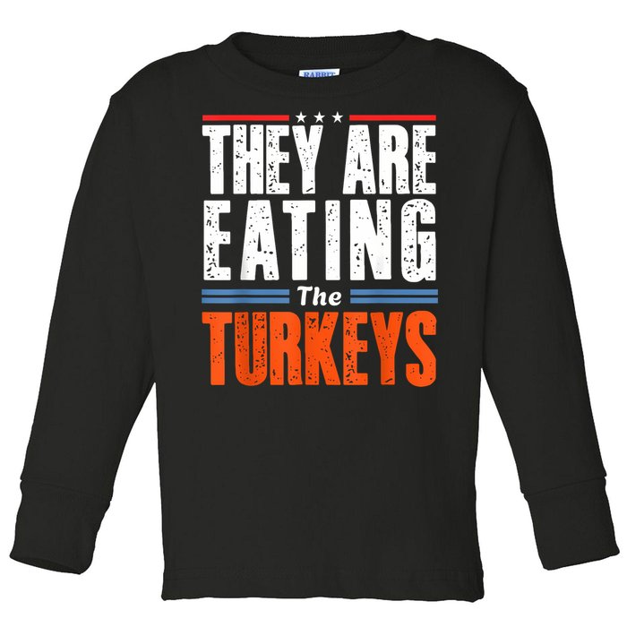 Funny Trump Saying They Are Eating The Turkeys Toddler Long Sleeve Shirt