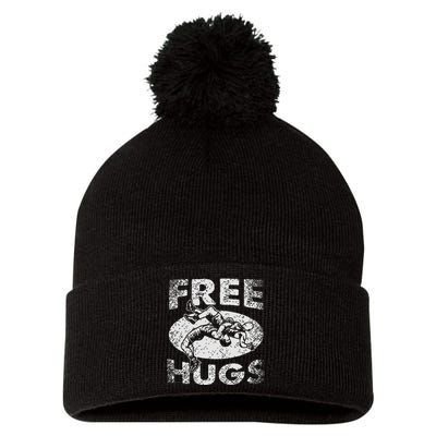 Funny Wrestling Funny Free Hugs Wrestling Gift Pom Pom 12in Knit Beanie