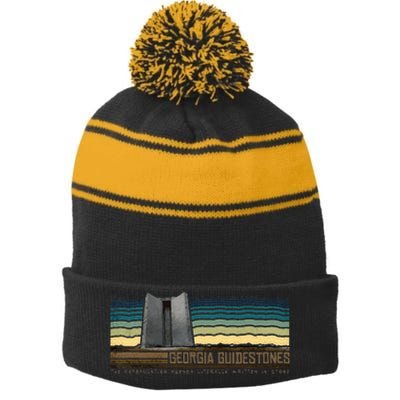 Georgia Guidestones  Depopulation Written In Stone Retro Stripe Pom Pom Beanie