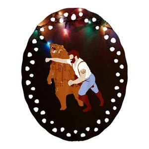 Guy Punching Bear Ceramic Oval Ornament