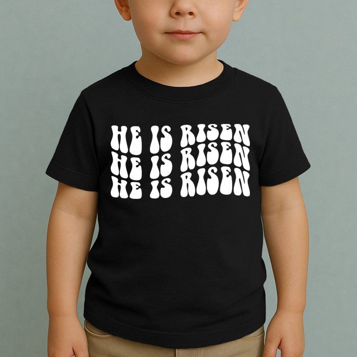 He Is Risen Jesus Retro Groovy Easter Toddler T-Shirt