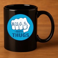 HUGS NOT THUGS 11oz C Handle Ceramic Mug