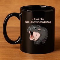 Hold On I_m Overstimulated Moo Deng Baby Hippo Moo 11oz C Handle Ceramic Mug