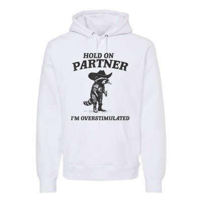 Hold On Partner IM Overstimulated Cowboy Raccoon Vintage Premium Hoodie