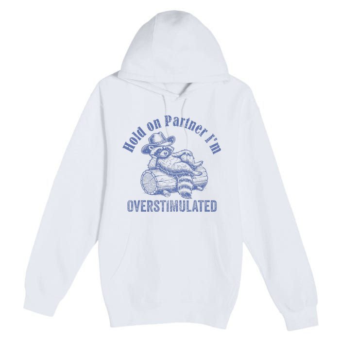 Hold On Partner IM Overstimulated Cowboy Raccoon Vintage Premium Pullover Hoodie