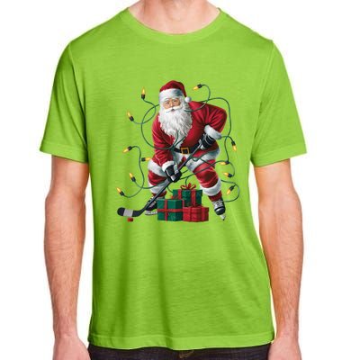 Hockey Player Xmas Lighting Santa Playing Hockey Christmas Gift Adult ChromaSoft Performance T-Shirt