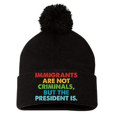 Immigrants Are Not Criminals But The President Is Design  Pom Pom 12in Knit Beanie
