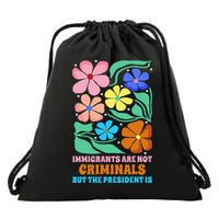 Immigrants Are Not Criminals But The President Is  Drawstring Bag