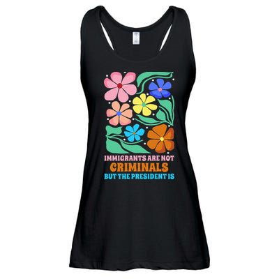 Immigrants Are Not Criminals But The President Is  Ladies Essential Flowy Tank
