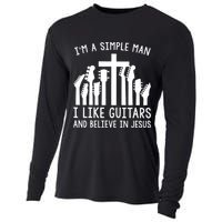 Im A Simple Man I Like Guitars And Believe In Jesus Cooling Performance Long Sleeve Crew