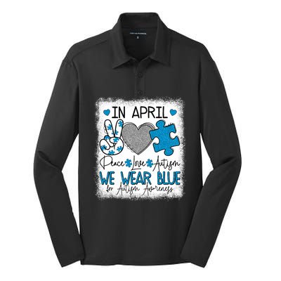 In April We Wear Blue For Autism Awareness Peace Love Autism Silk Touch Performance Long Sleeve Polo