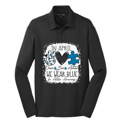 In April We Wear Blue For Autism Awareness Peace Love Autism Silk Touch Performance Long Sleeve Polo