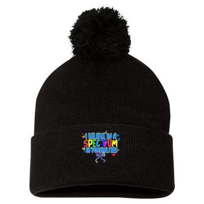 I Believe In A Spectrum Of Possibilities Retro Autism Bow Pom Pom 12in Knit Beanie