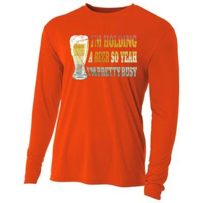 I'm Holding A Beer Of Yeah I'm Pretty Busy Gift For Beer Day Cooling Performance Long Sleeve Crew