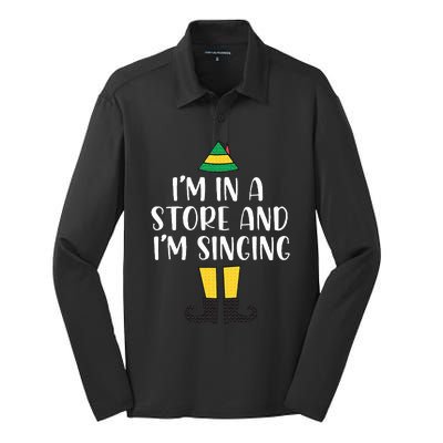 I'm in a store and I'm singing Christmas Buddy Elf Silk Touch Performance Long Sleeve Polo