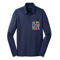 In My Field Day Era Teacher Funny Field Day 2024 Silk Touch Performance Long Sleeve Polo