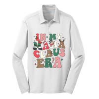 In My Mama Claus Era Christmas Silk Touch Performance Long Sleeve Polo