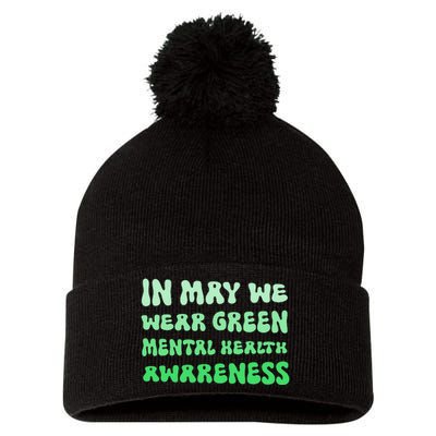 in May we carry the Green Month of Mental Health Awareness Pom Pom 12in Knit Beanie