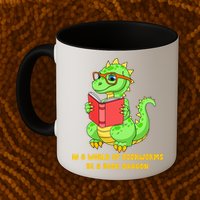 In A World Of Bookworms Be A Book Dragon Mug