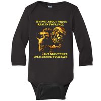 It’s Not About Who Is Real In Your Face But About Who’s Loyal Behind Your Back Baby Long Sleeve Bodysuit