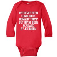 I'VE NEVER BEEN FONDLED BY DONALD TRUMP BUT I HAVE BEEN SCREWED BY JOE BIDEN Baby Long Sleeve Bodysuit