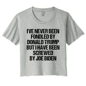 I'VE NEVER BEEN FONDLED BY DONALD TRUMP BUT I HAVE BEEN SCREWED BY JOE BIDEN Women's Crop Top Tee